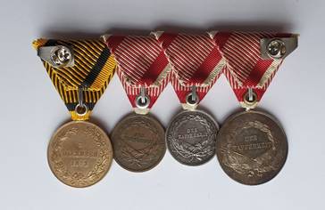 Ein Bild, das M�nze, Metall, Medaille, Bronze enth�lt.

Automatisch generierte Beschreibung